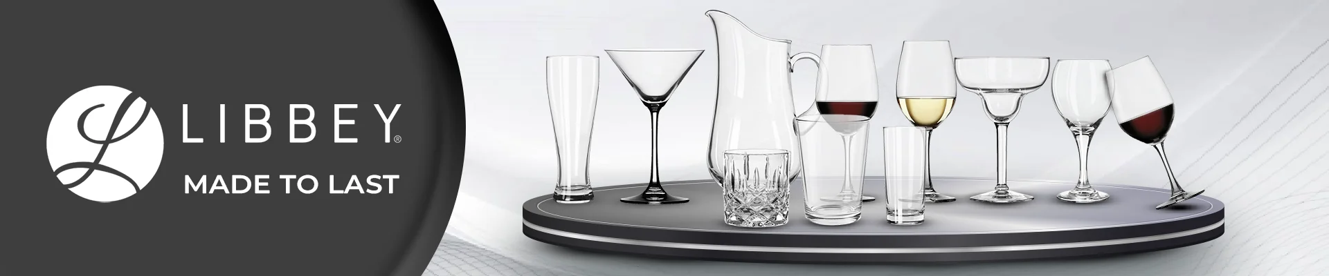 Libbey brand banner featuring a variety of clear glassware including tumblers, mugs, and highball glasses on a gradient orange and black background.