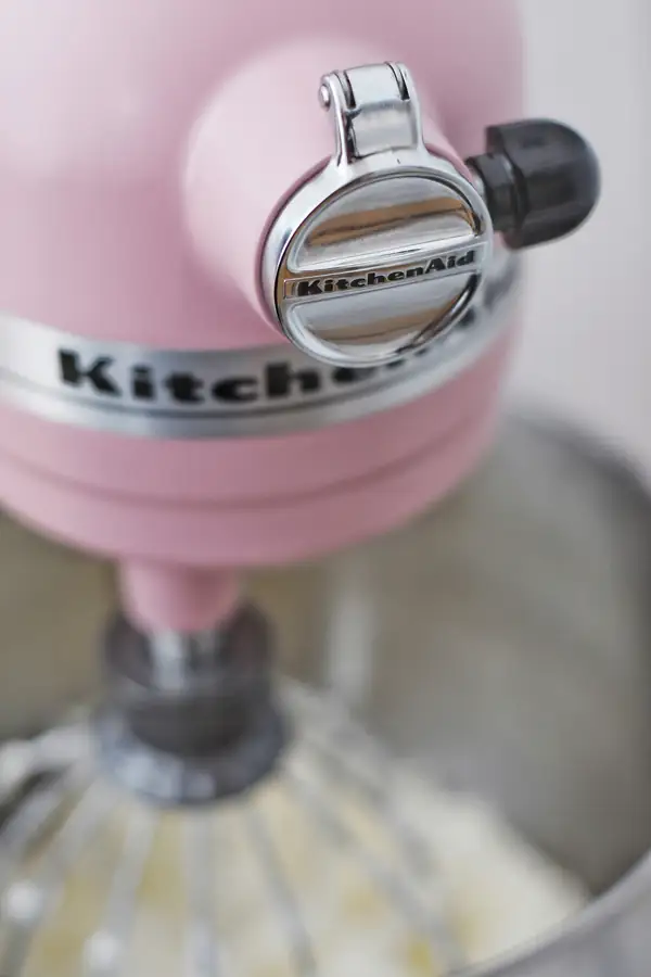 Vertical cutter mixer with a chef preparing dough