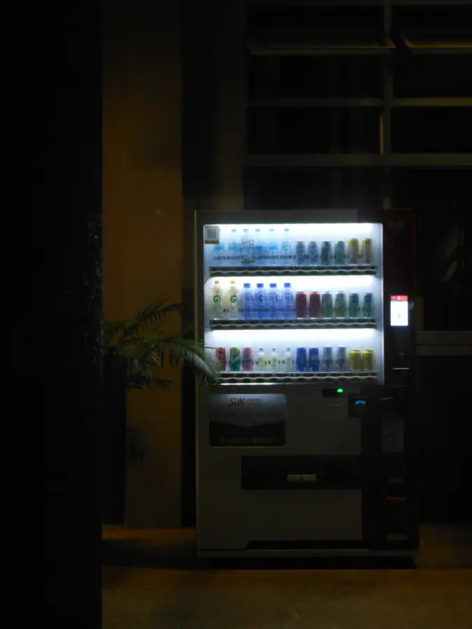 Product display with vibrant lighting in a glass door refrigerator