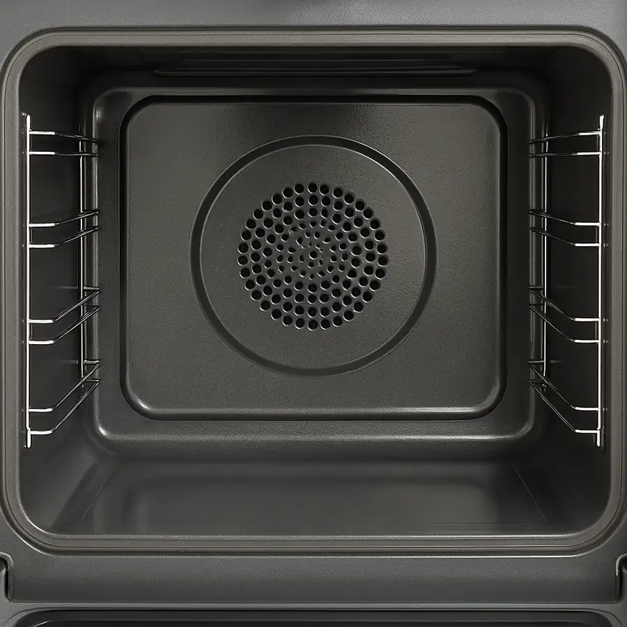 A photo of an easy-clean oven interior with rounded corners and removable rack guides.