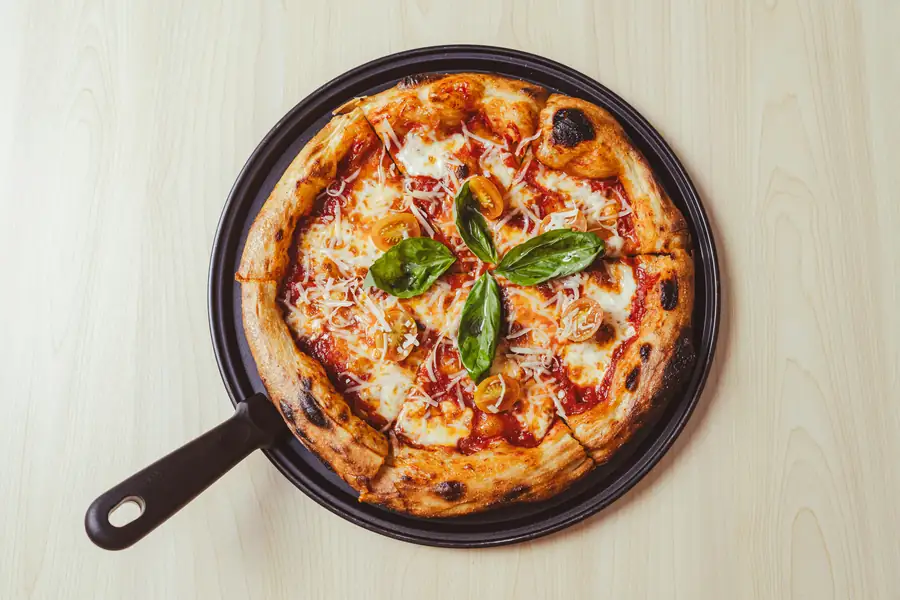 A cost comparison chart showing pizza oven investment and return on investment