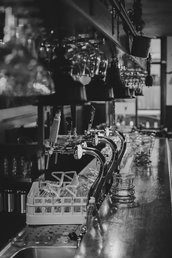 Various beverage dispensing systems set up on a bar counter
