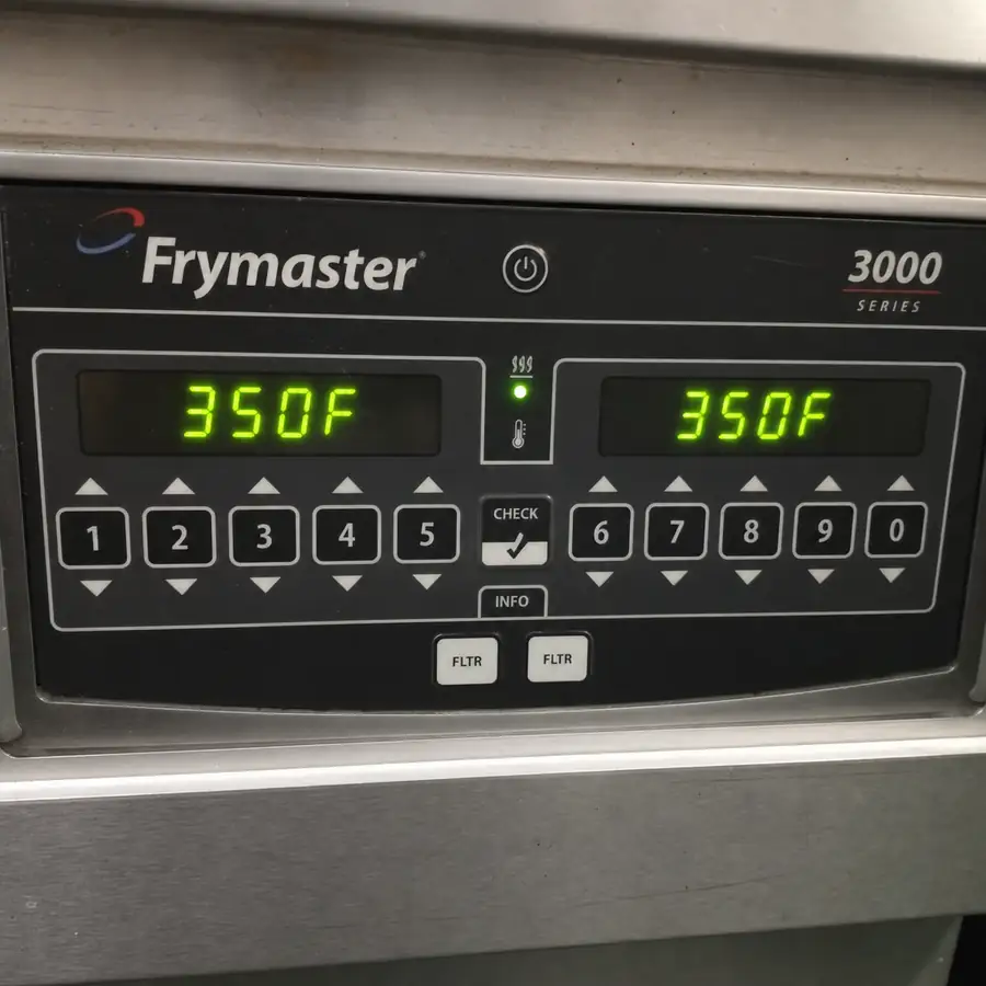 Close up of a modern Frymaster commercial fryer control panel with digital display