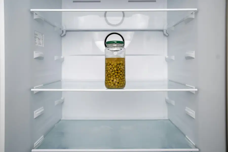 Diagram showing proper installation and spacing for a display refrigerator