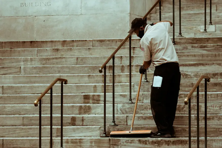 Professional cleaner using specialized equipment