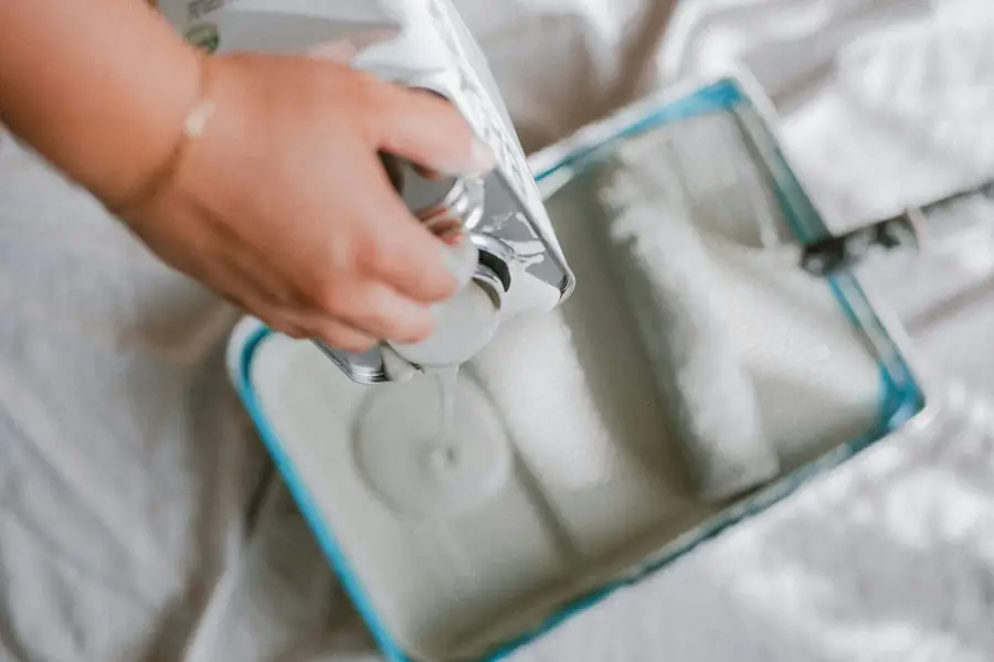 Person cleaning a nugget ice maker with a cloth