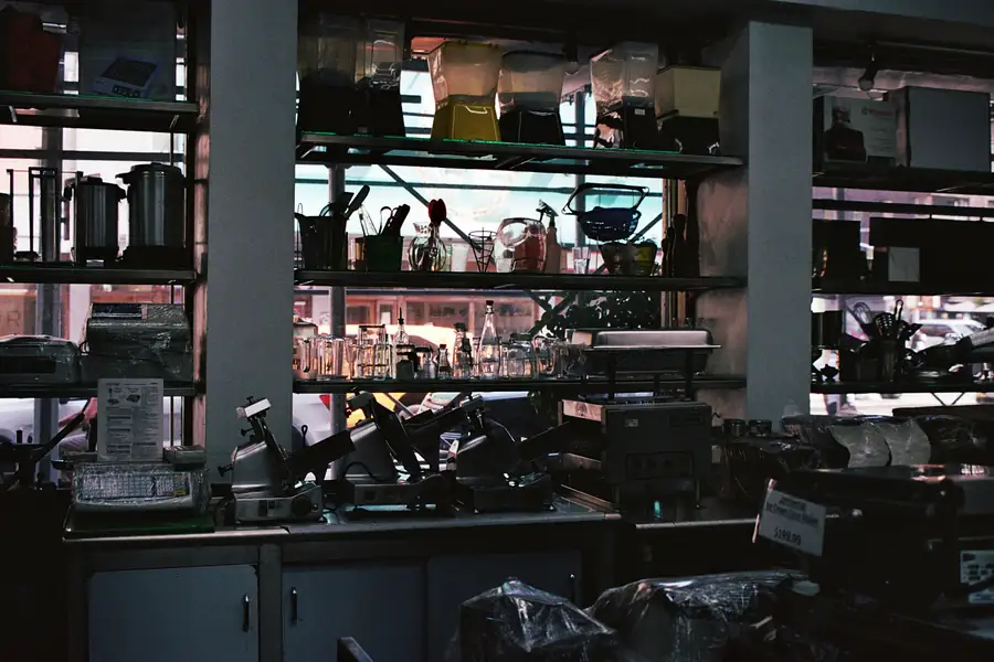 Technician performing maintenance on commercial kitchen equipment