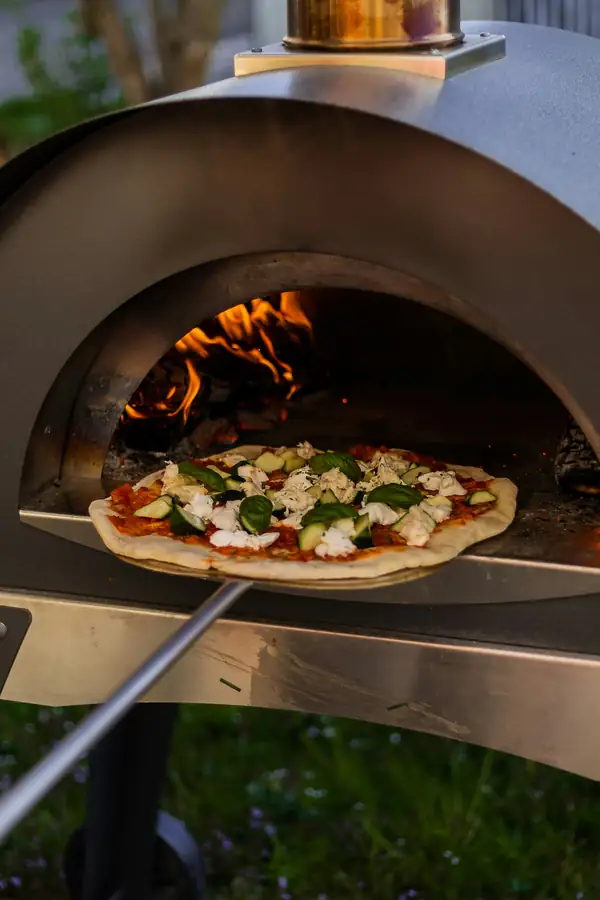 A bustling pizzeria with high-performance pizza ovens