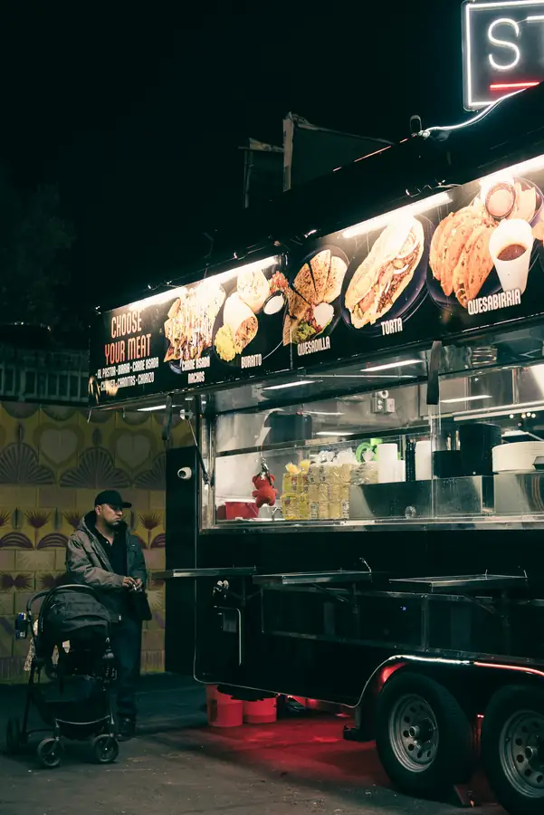Food truck serving window with supplies