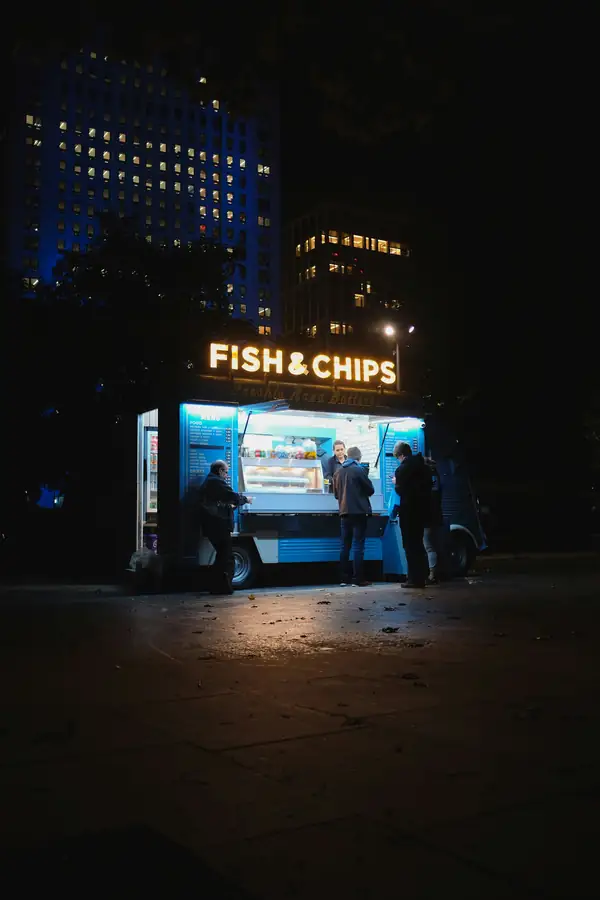 A food truck with bright signage and effective lighting