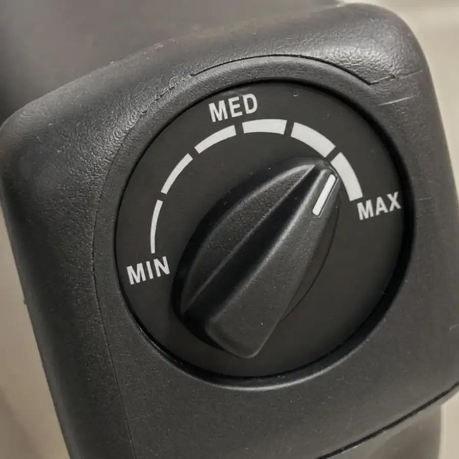 Close up of variable speed dial on a commercial immersion blender handle