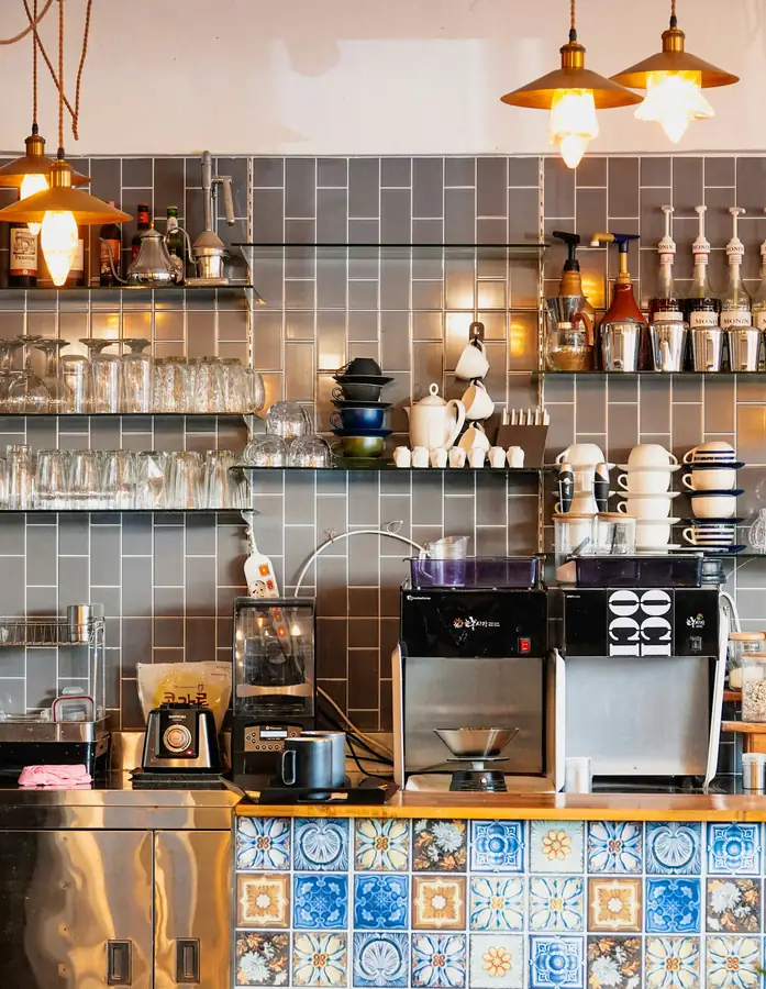 Image of cafe accessories including cups, saucers, and platters