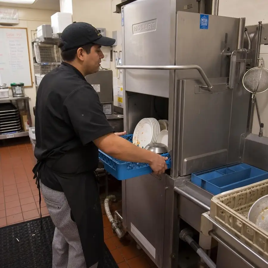 Door-type pass-through commercial dishwasher used in mid-sized restaurant dish rooms