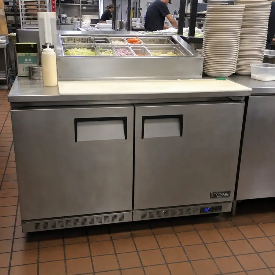 Undercounter refrigeration and prep tables for tight commercial kitchen spaces