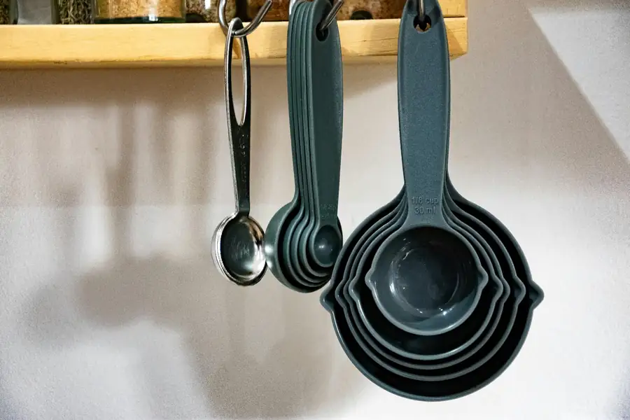 Measuring cups, spoons, and digital scales for commercial kitchen accuracy