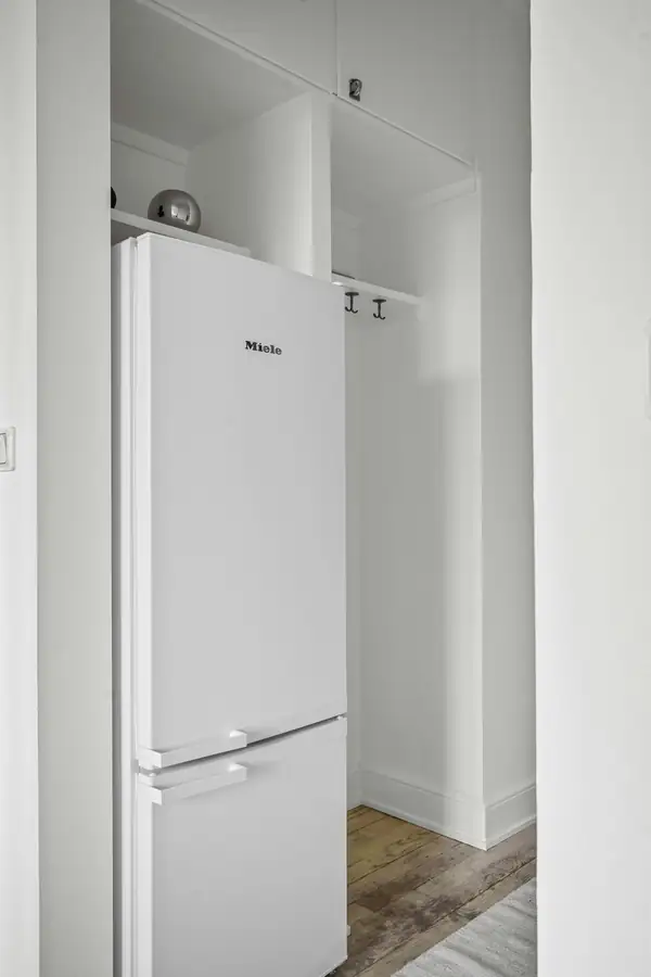 Chef reviewing fresh inventory to assess walk-in refrigerator storage needs