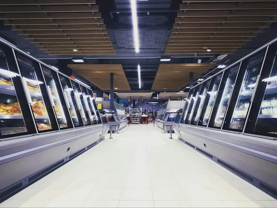 Adjustable shelving and door clearance features that affect commercial freezer usability