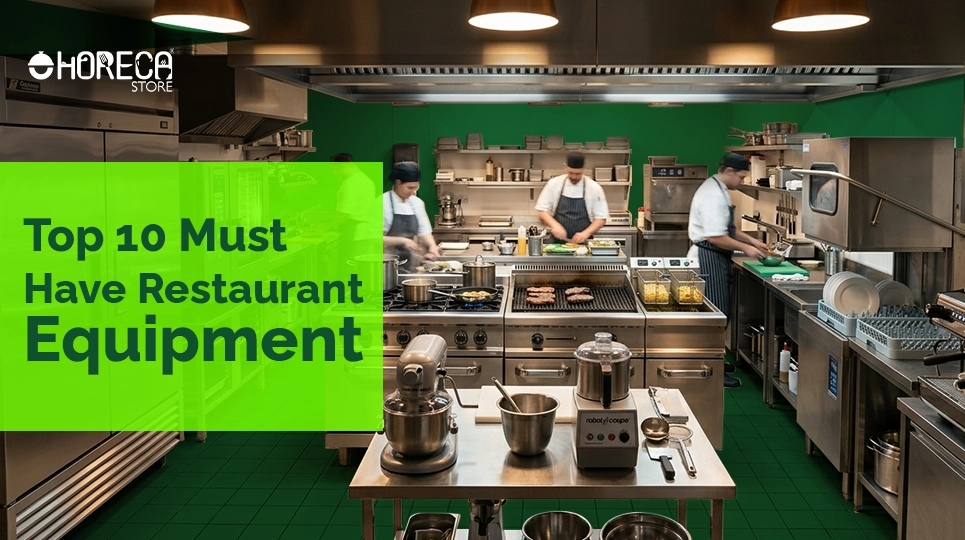 Commercial restaurant kitchen with chefs cooking and stainless steel equipment, highlighting top 10 must have restaurant equipment for professional kitchens and food businesses