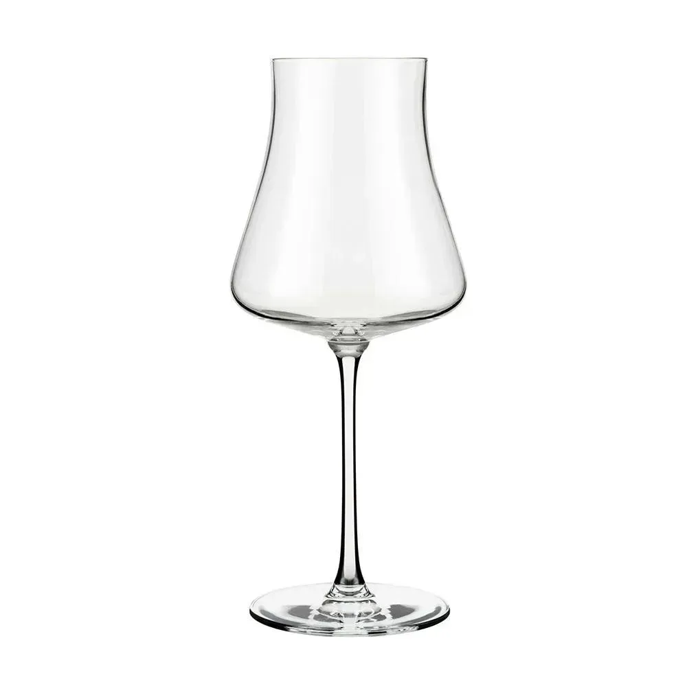 Sophisticated crystal wine glass from Libbey showcasing golden chardonnay with a delicate rim and elongated stem on a slate tray near grapes.