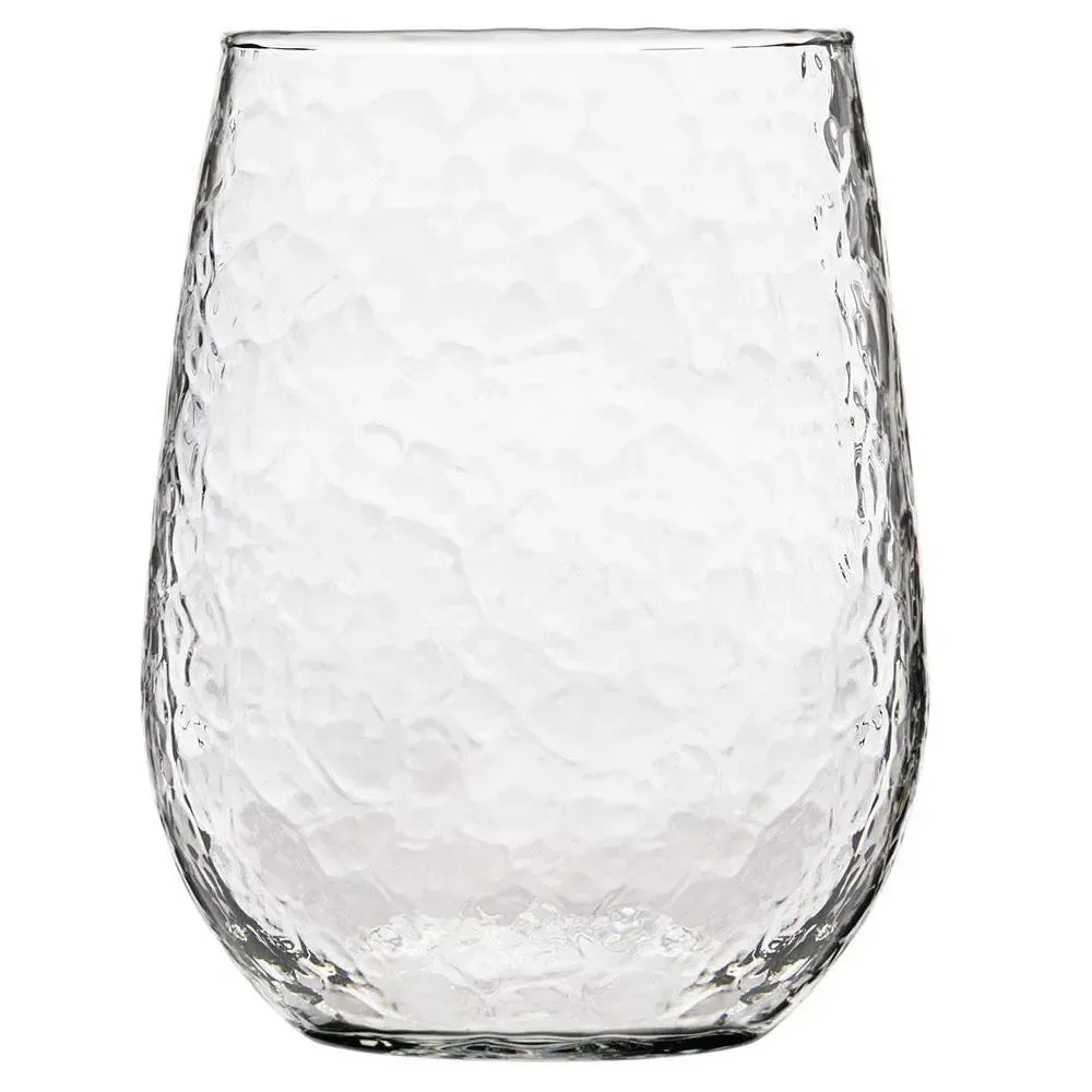 Clear stemless wine glass from Libbey with a hammered texture for a stylish, elegant touch, ideal for adding visual interest to wine service.