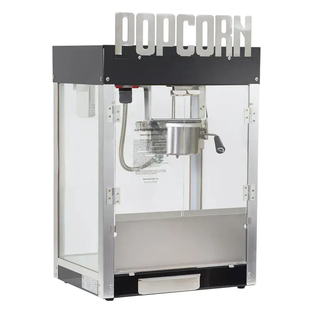 Sleek black and chrome metropolitan popcorn popper by Winco glows under ambient lighting, adding premium flair to entertainment spaces.