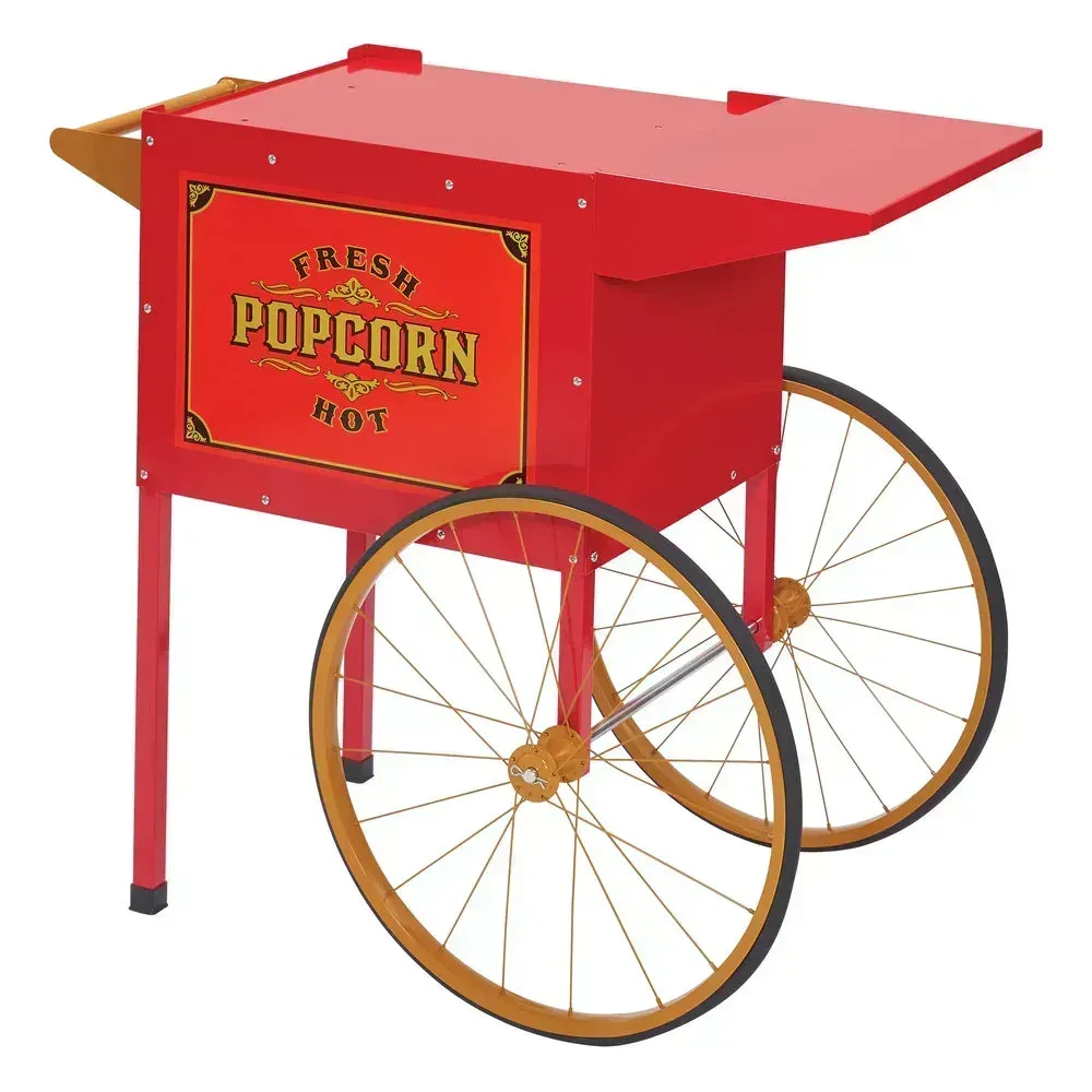 Popcorn cart from Winco with sturdy wheels and a red canopy, parked on brick pavement and ready for an outdoor event under a warm sunset glow.