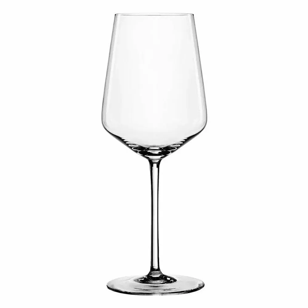 Graceful crystal white wine glass by Libbey with chilled riesling on a marble slab near seashells, ideal for coastal dining themes.