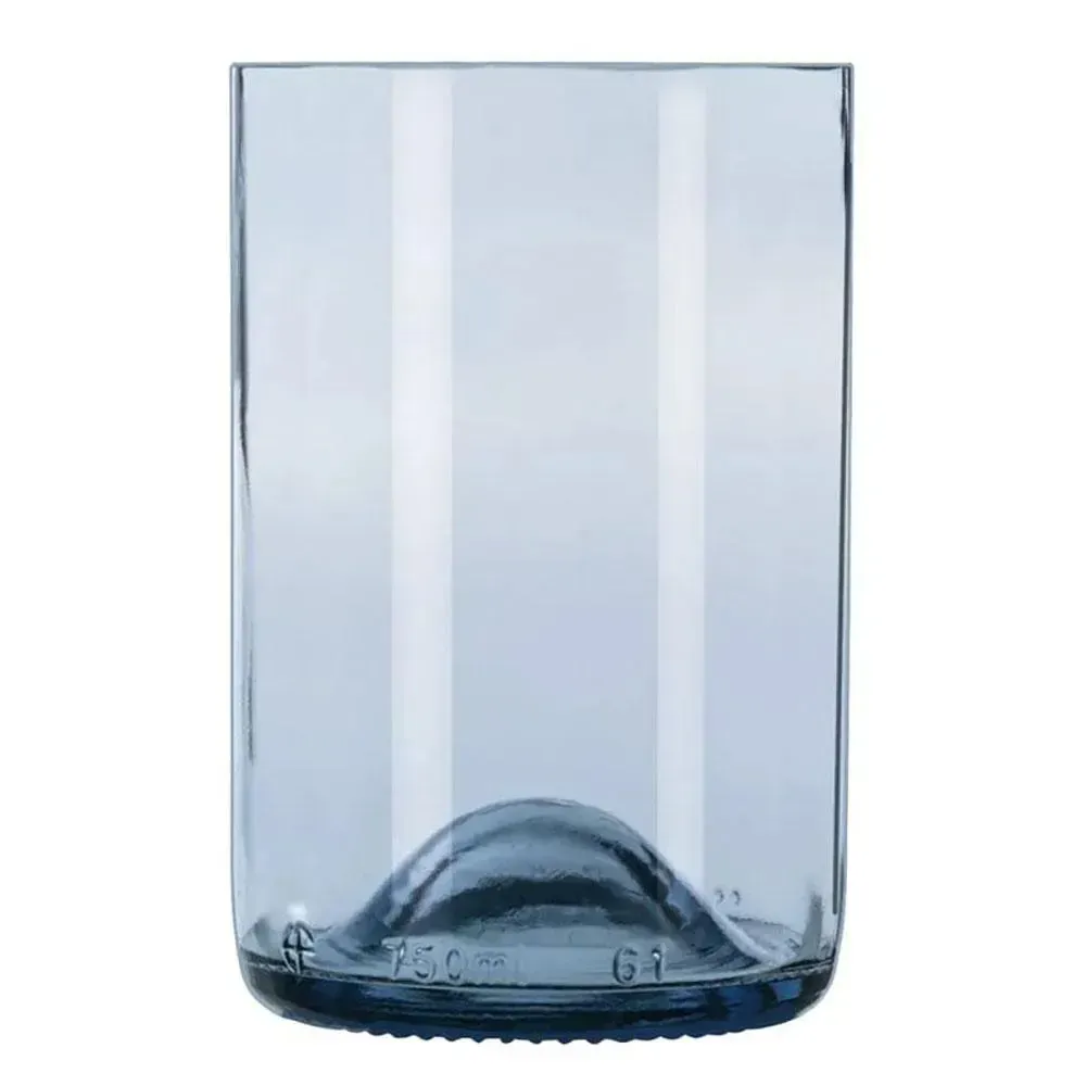 Ocean blue repurposed tumbler by Libbey with iced tea and a citrus slice on a driftwood table during a sunset beach scene with relaxed vibes.