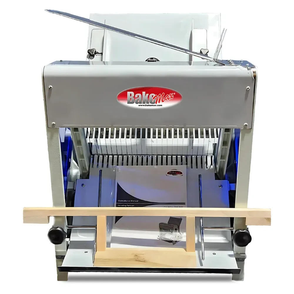 BakeMax BMGF001-6 Titan Series countertop bread slicer with stainless steel housing, gravity feed design, safety guard, and efficient bread slicing.