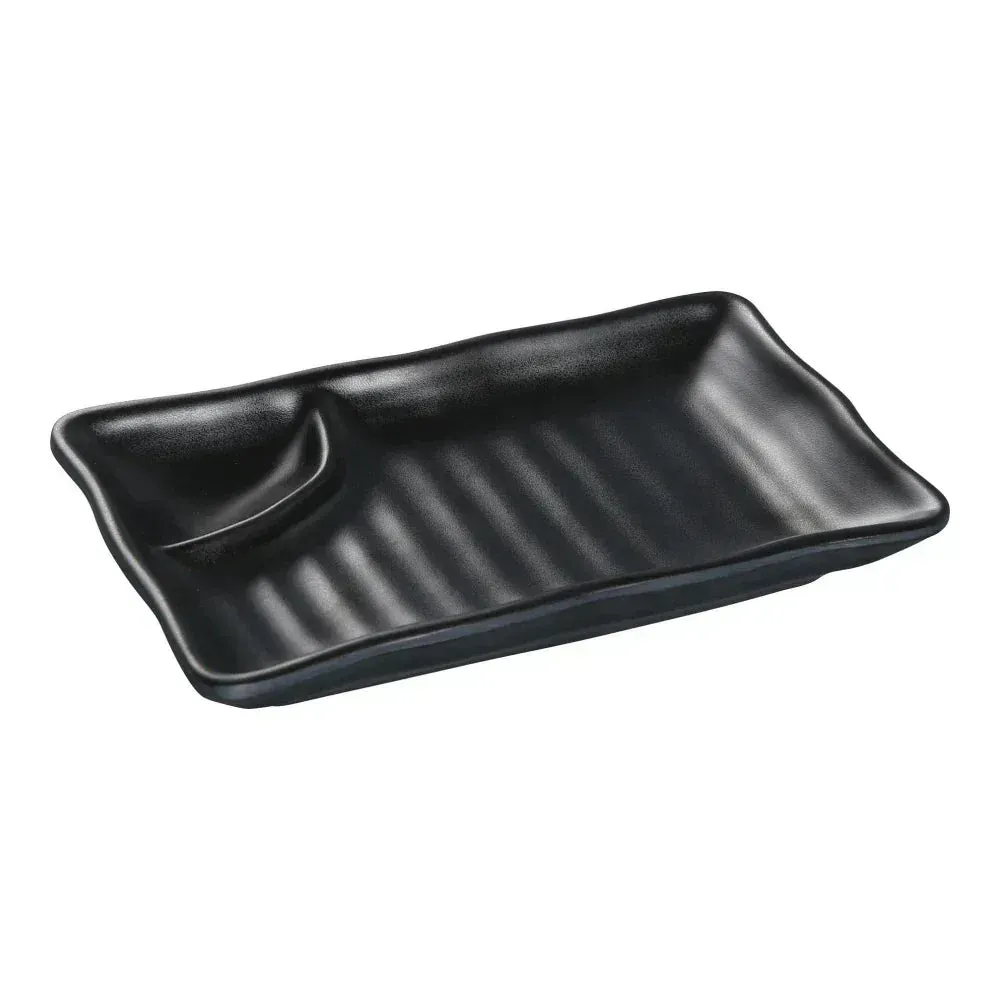 Matte black melamine plate from Yanco China with two compartments, ideal for serving sauces or sides in a modern, elegant style for any dining.