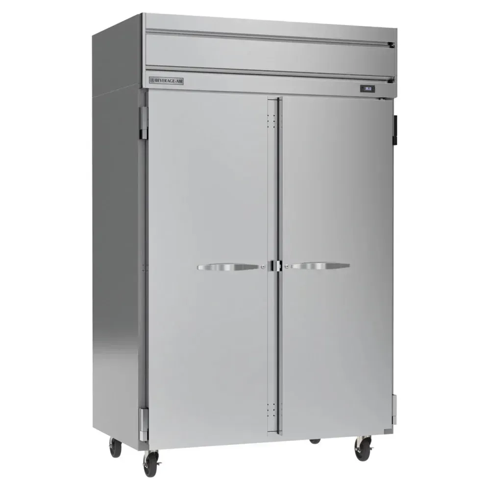 Beverage-Air double solid-door reach-in refrigerator with top-mounted compressor standing sleek along kitchen walls under warm ambient lighting.