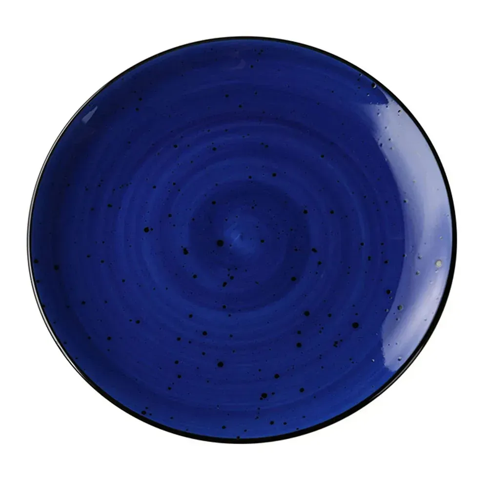 Small round Yanco China coupe plate with rustic speckled blue glaze, ideal for salads, desserts, or vibrant small-course presentations.