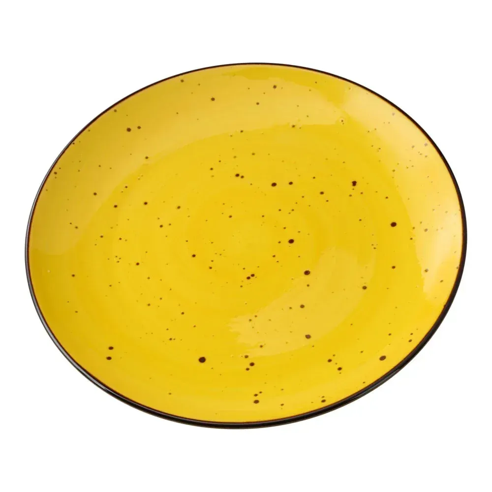 Round coupe plate by Yanco China with a speckled reactive yellow glaze, a durable piece perfect for artisanal entrée presentations.