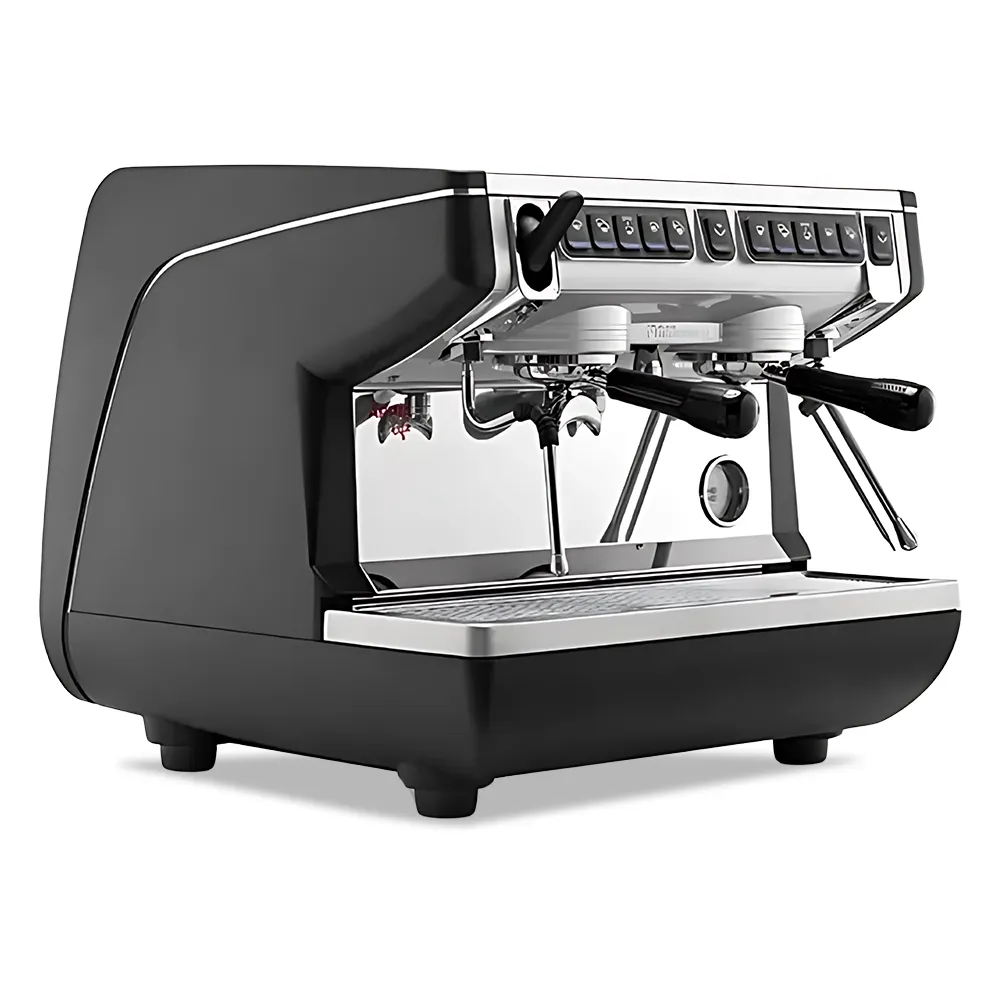Nuova Simonelli advanced espresso machine with auto steam wand, lit workspace, and stainless body on clean bar with frothing pitcher nearby.