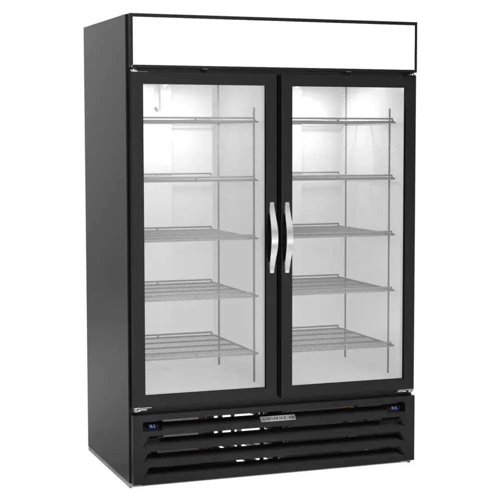 Beverage-Air black glass door dual-temp merchandiser illuminated under bright LEDs, sleek frame displays chilled and frozen products on retail floor.