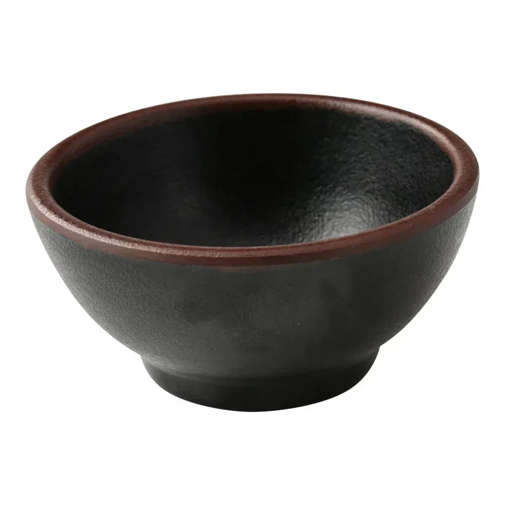 Yanco China black melamine round sauce dish with compact form and neat edges, ideal for condiments or dipping sauces in a clean setup.