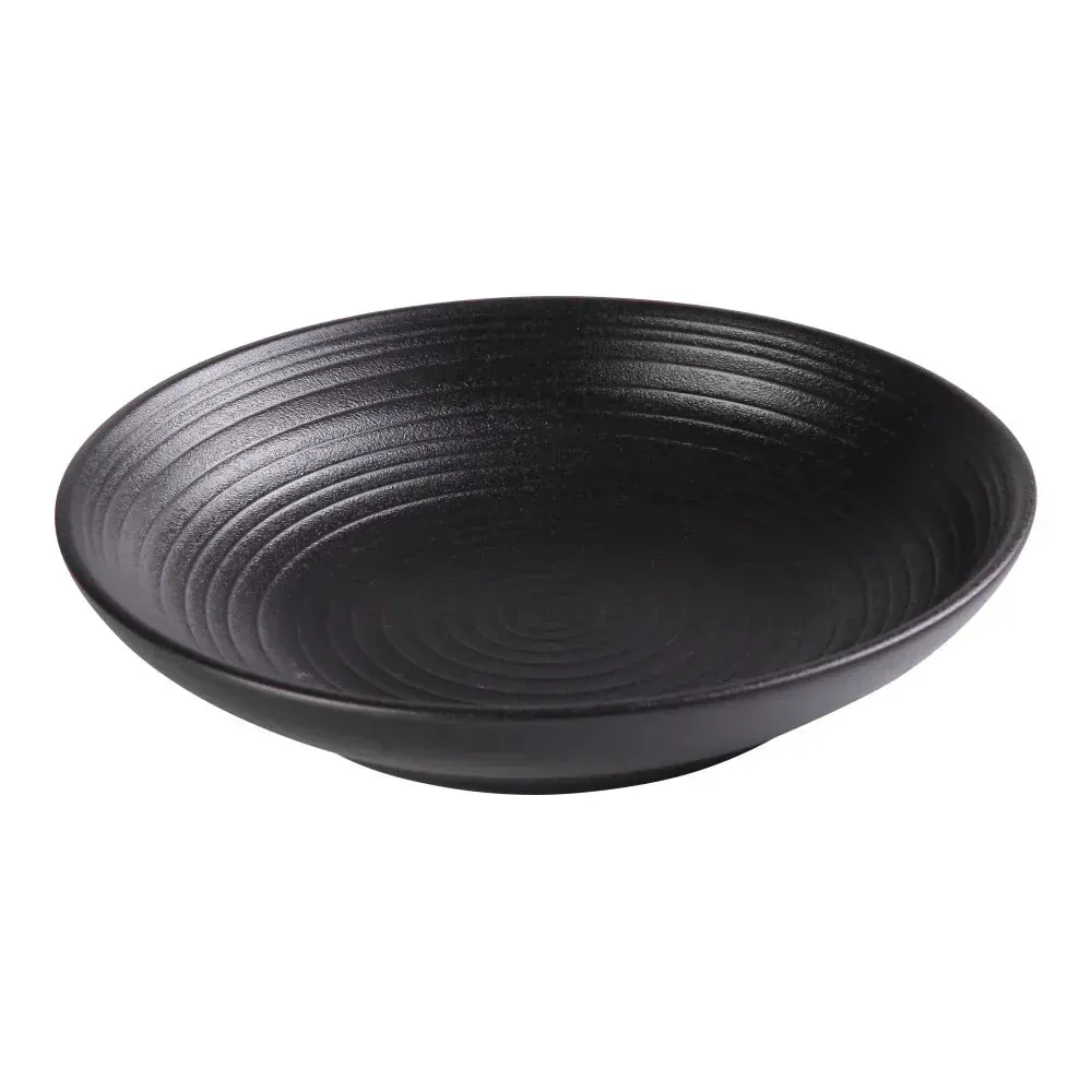 Yanco China versatile black chinaware salad pasta bowl, ideal for hotel Caesar salads, restaurant carbonara, or café Greek salads in round form.