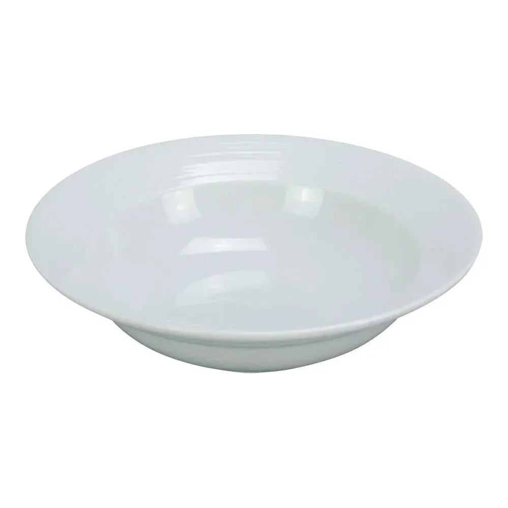 White Yanco chinaware grapefruit bowl, curved to cradle citrus halves, adding elegance to breakfast tables, brunch buffets, or fruit presentations.
