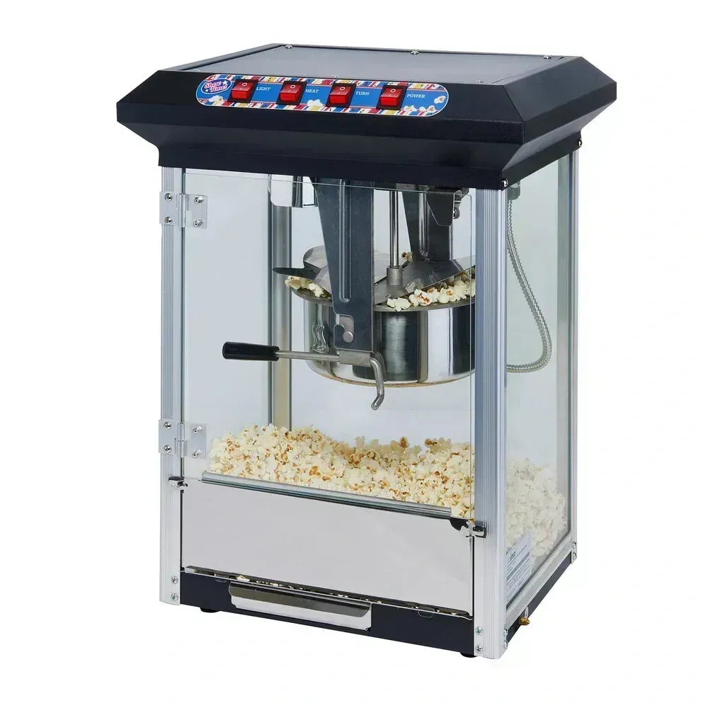 Classic black popcorn machine by Winco with a glowing kettle adds charm and function to any countertop concession setup or snack station.