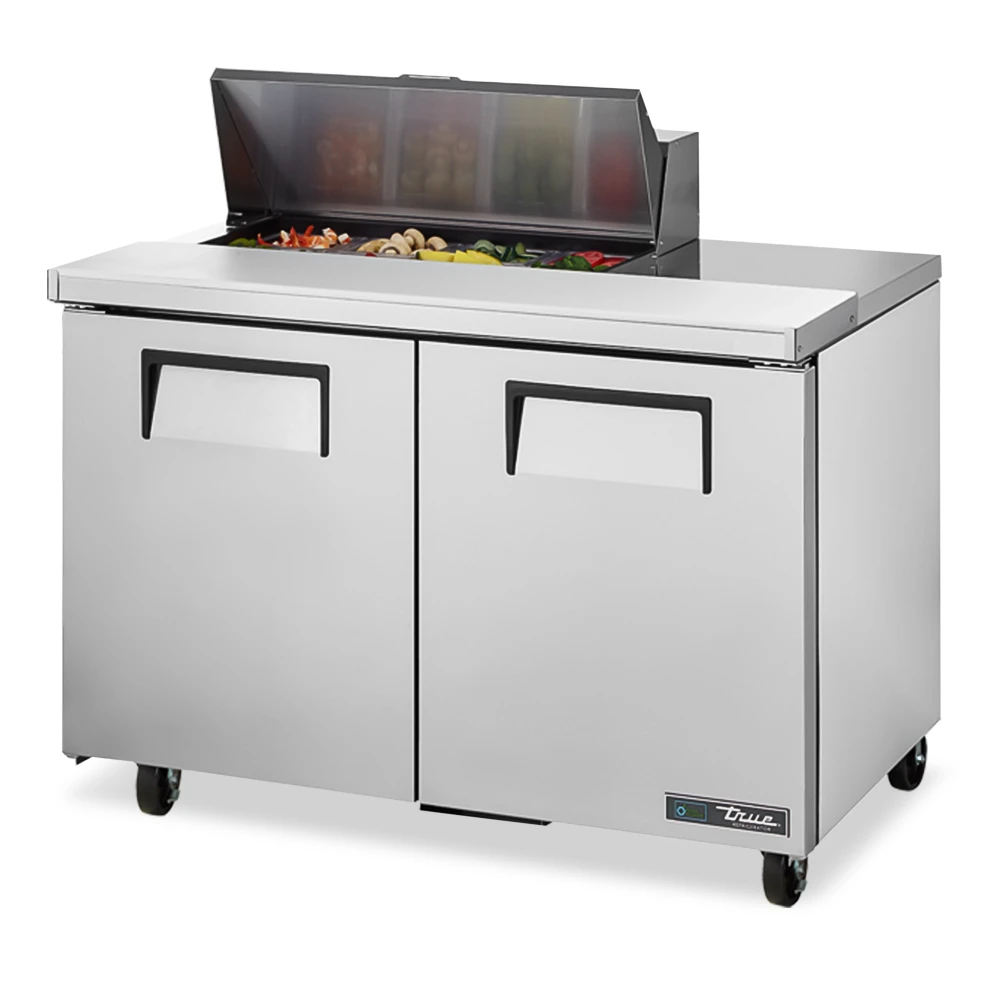 True compact prep table with two doors and refrigerated base, delivering reliable cold storage for smaller commercial kitchens.