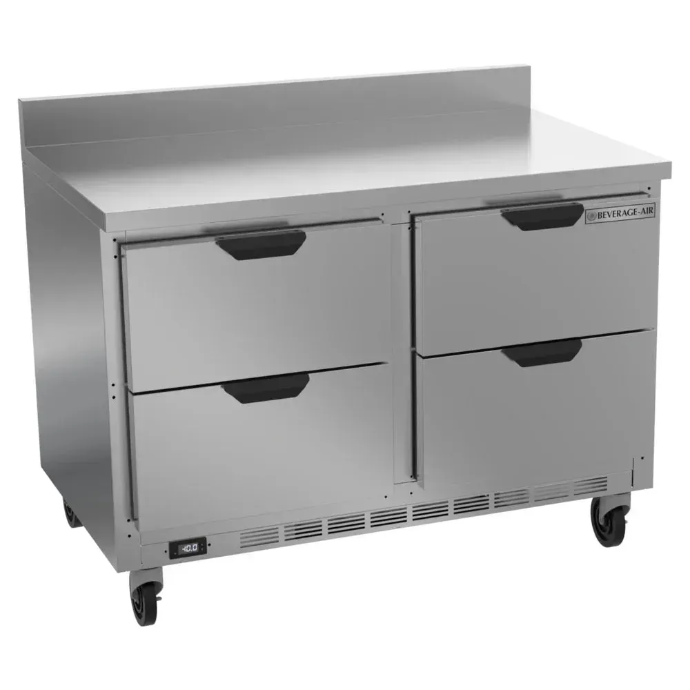 Four-drawer worktop freezer with backsplash protects walls while storing ingredients; Beverage-Air stainless unit supports efficient cafe prep work.