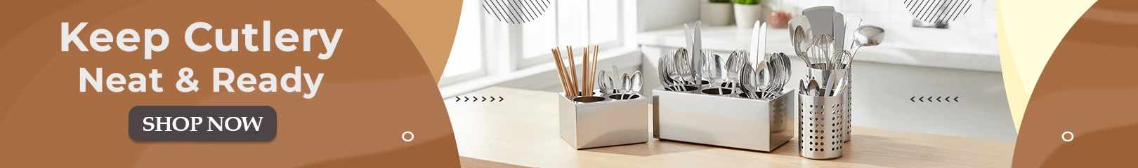 Organized cutlery holders with spoons, forks, knives, and chopsticks neatly arranged on a clean kitchen counter.